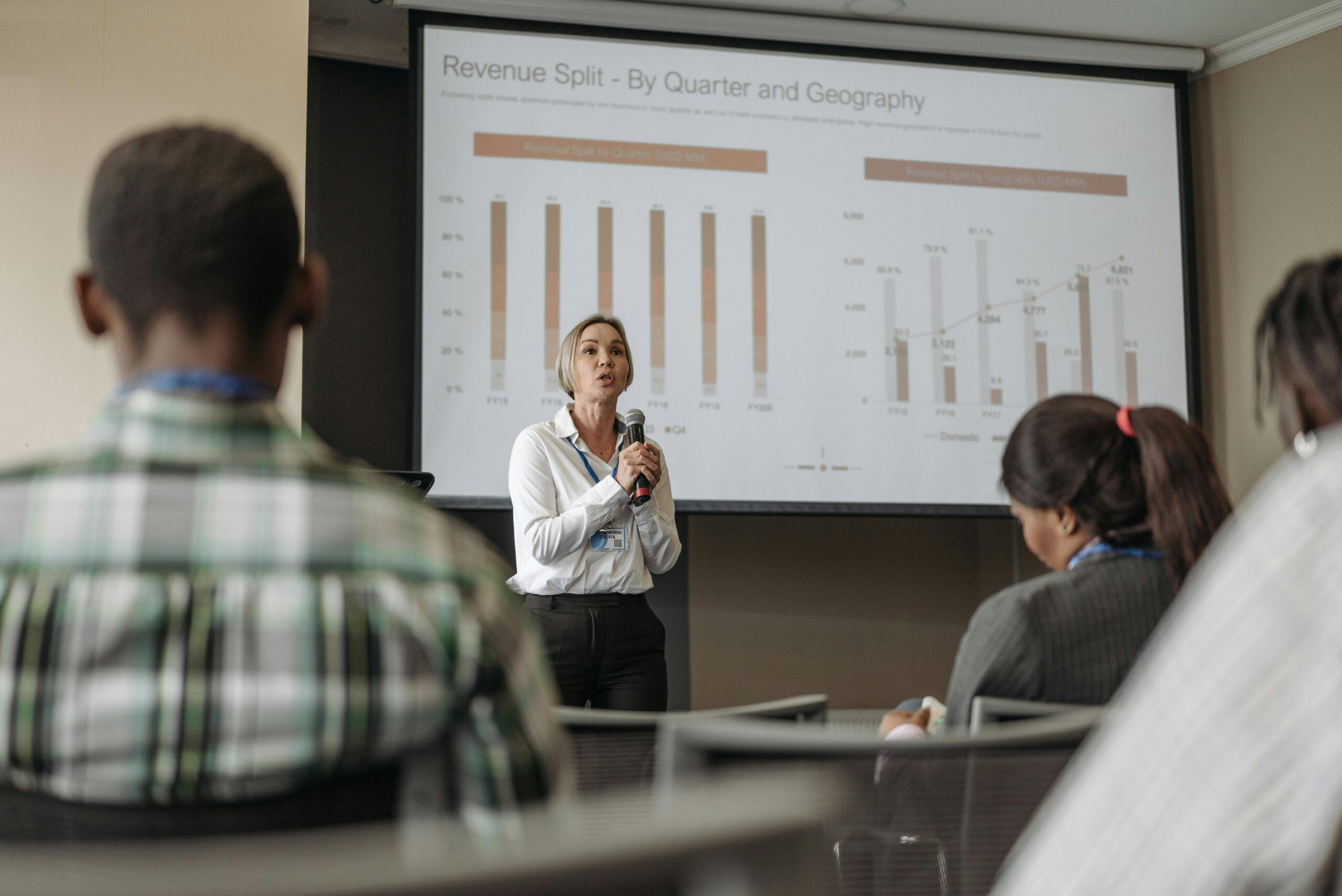 woman presenting to crowd