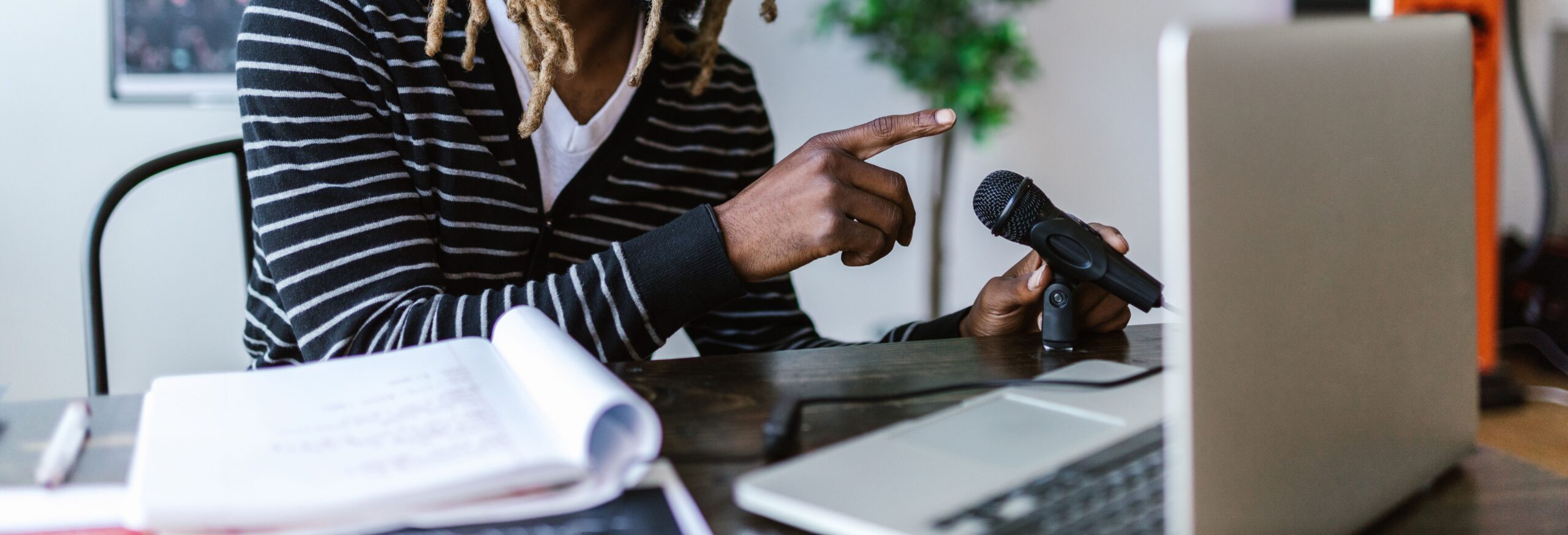 man with microphone and laptop 