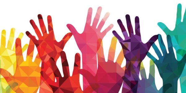 multicolored hands reaching up